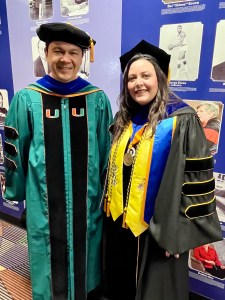 Dr. Vladislav Maksimov and Dr. Heather Carle at the Doctoral and Master’s Commencement at UNC Greensboro, May 7, 2026.